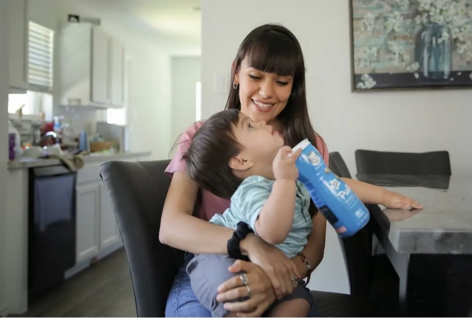 Nataly Romero, who has been having trouble finding baby formula, holds her son Alex in their Baytown home on May 12, 2022.